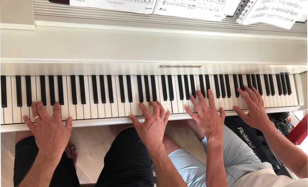 4 handen op de piano 