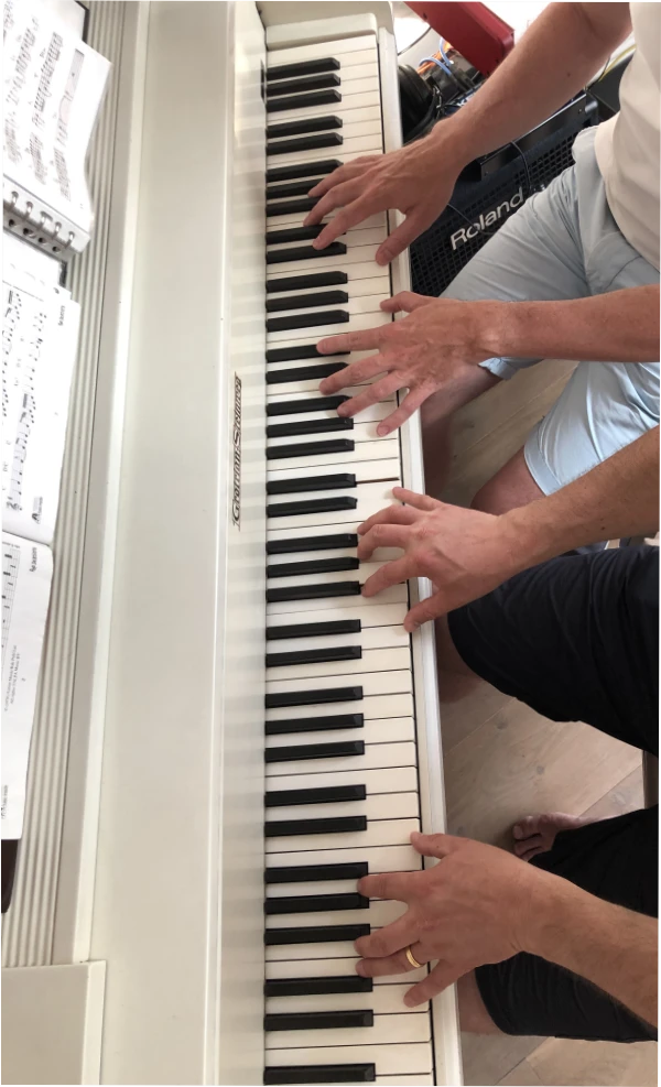 4 handen op de piano